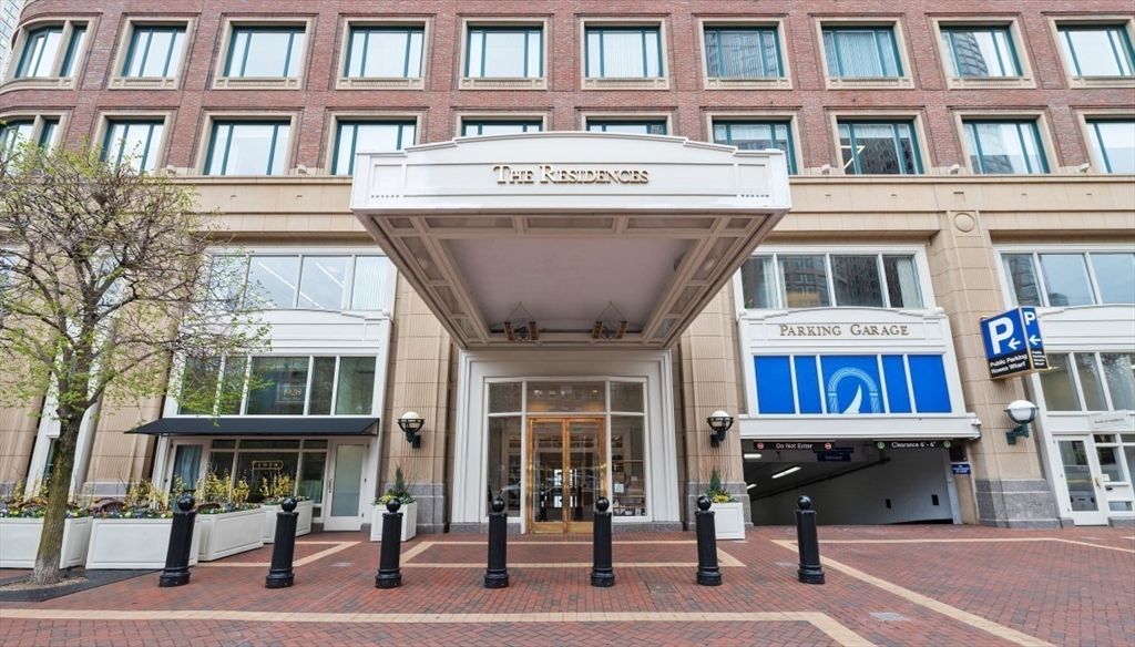 20 Rowes Wharf, Unit PH4 Boston, MA 02110 - Photo 1 of 24 a view of a building with a bench