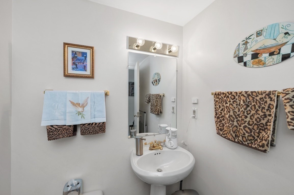 20 Rowes Wharf, Unit PH4 Boston, MA 02110 - Photo 14 of 24 a bathroom with a sink and a mirror