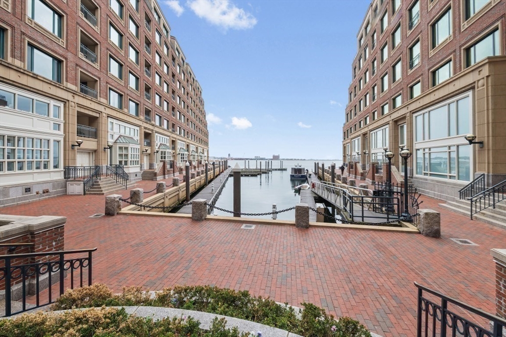 20 Rowes Wharf, Unit PH4 Boston, MA 02110 - Photo 16 of 24 a view of a building with cars park