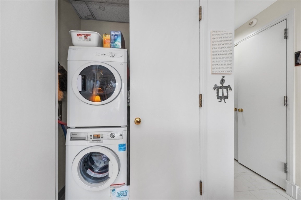 20 Rowes Wharf, Unit PH4 Boston, MA 02110 - Photo 21 of 24 a utility room with dryer and washer