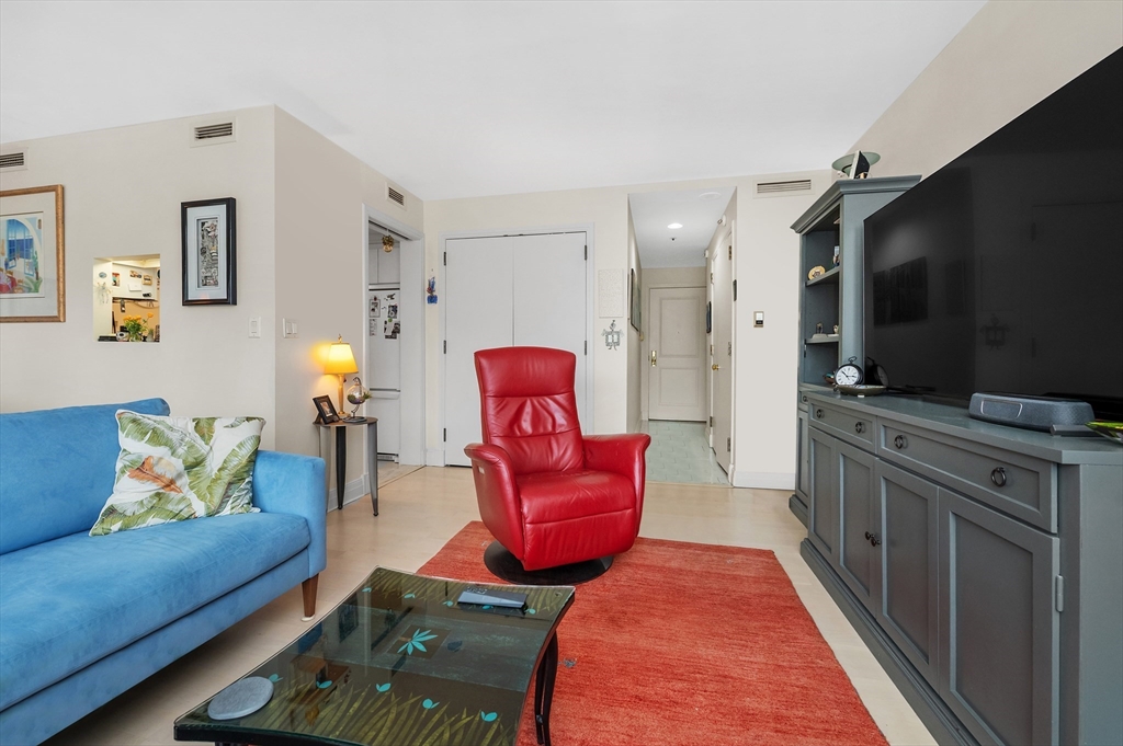20 Rowes Wharf, Unit PH4 Boston, MA 02110 - Photo 6 of 24 a living room with furniture and a flat screen tv