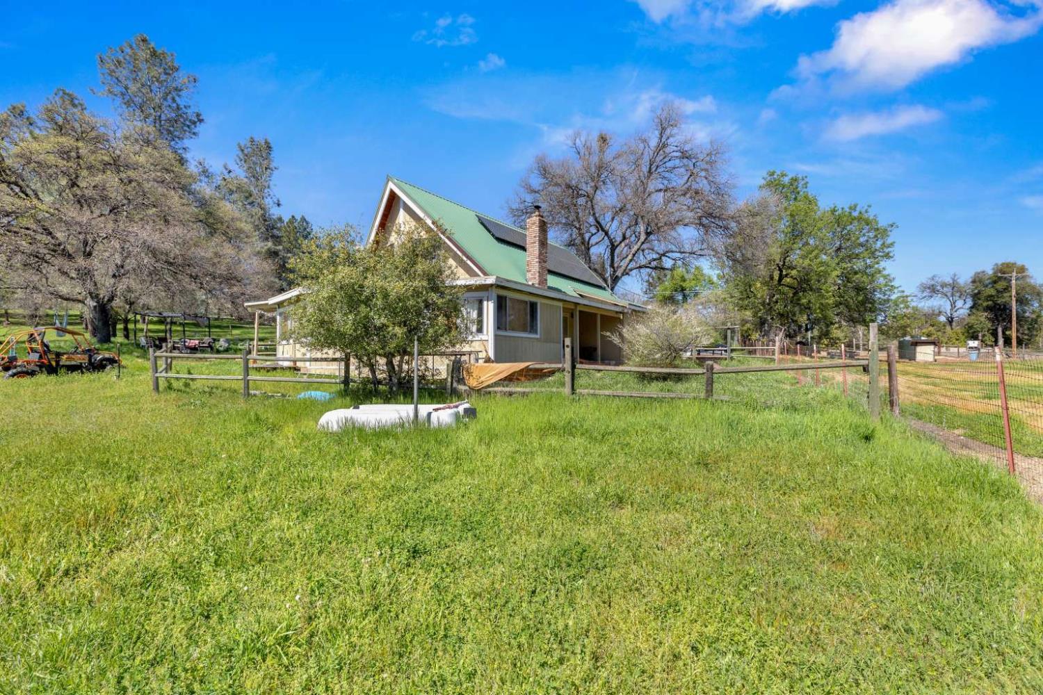 13489 Yorkshire Road Groveland, CA 95321 - Photo 33 of 35 a view of a house with a big yard and a large tree