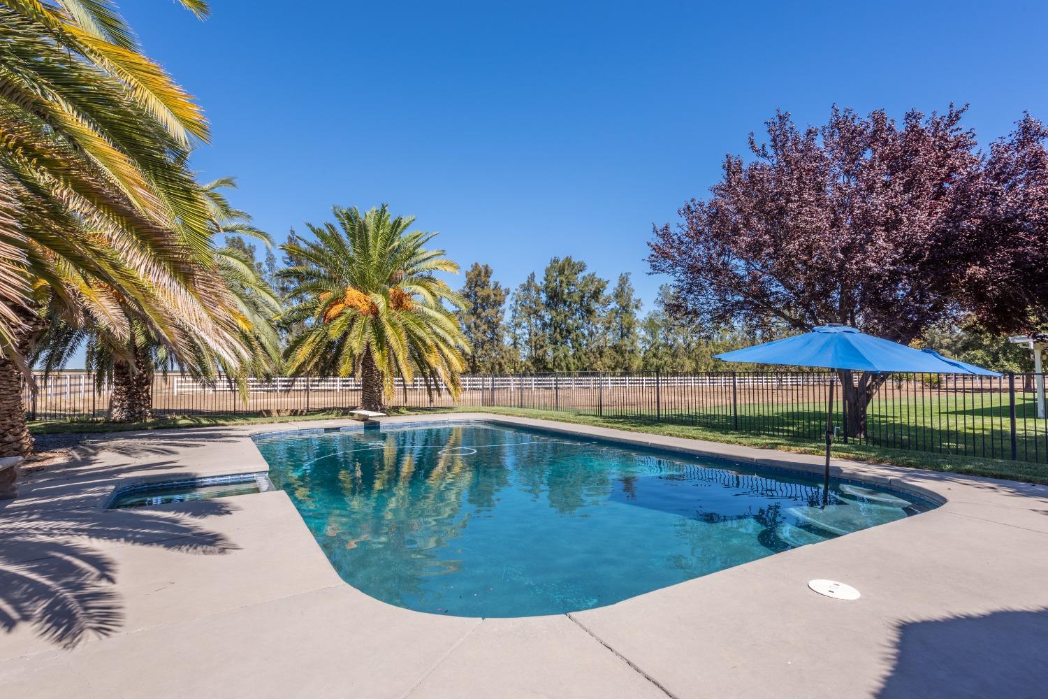a view of a swimming pool with an outdoor space and seating area