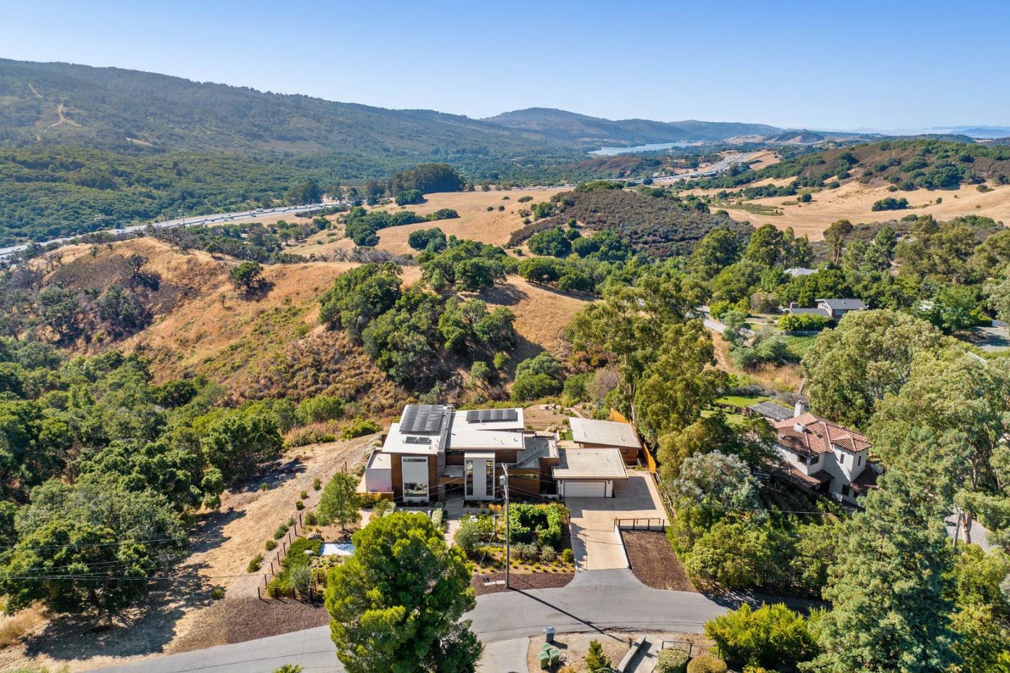 an aerial view of a house with mountain view