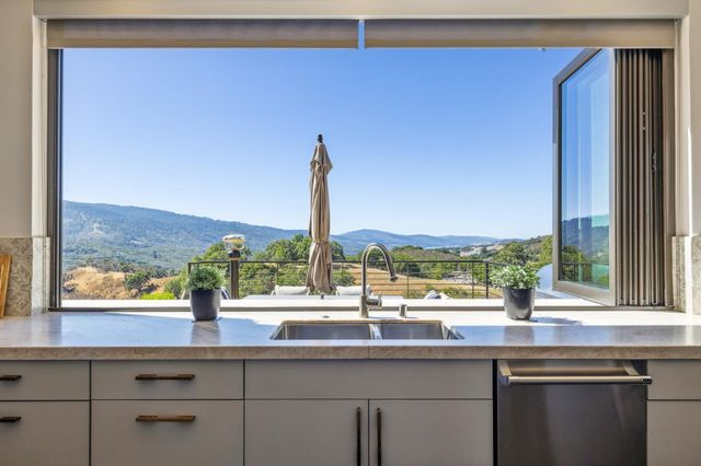 a kitchen with a table and chairs