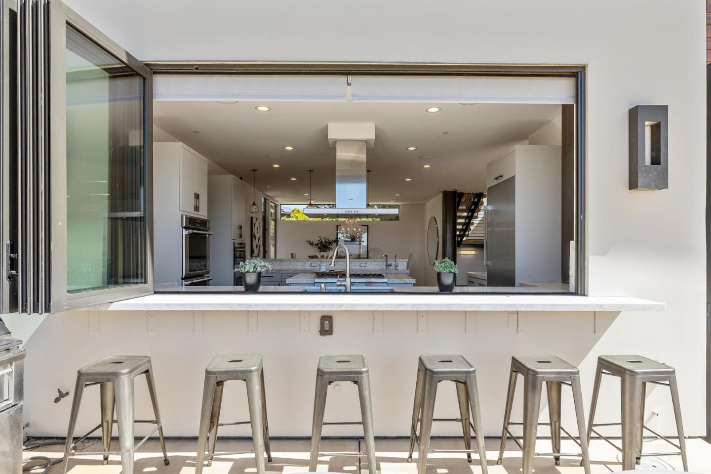 481 West Maple Way Woodside, CA 94062 - Photo 12 of 44 a kitchen with a table and chairs