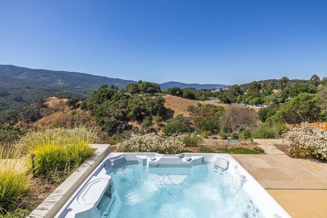 a view of a patio with a table and chairs