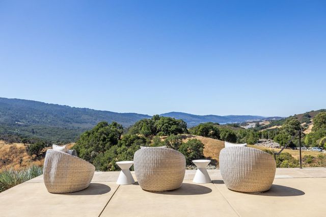 a view of a backyard with chair