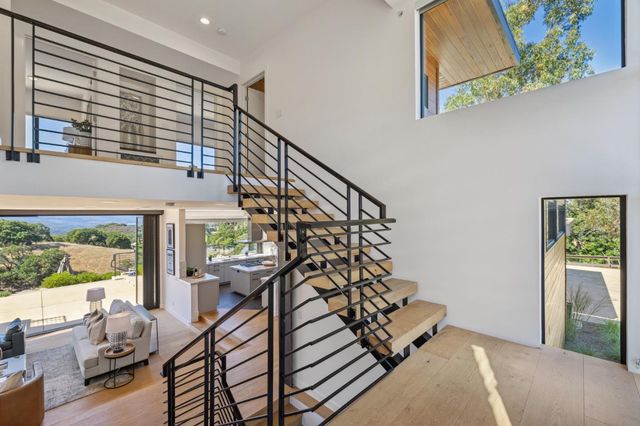 a view of kitchen and dining room with wooden floor