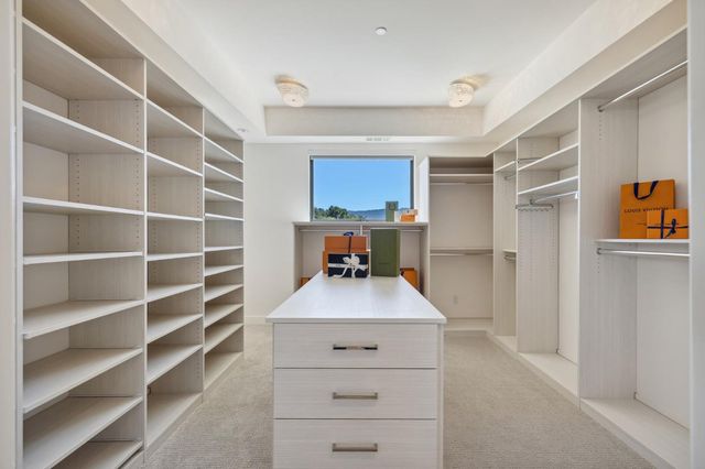 a spacious bedroom with a bed and a couch