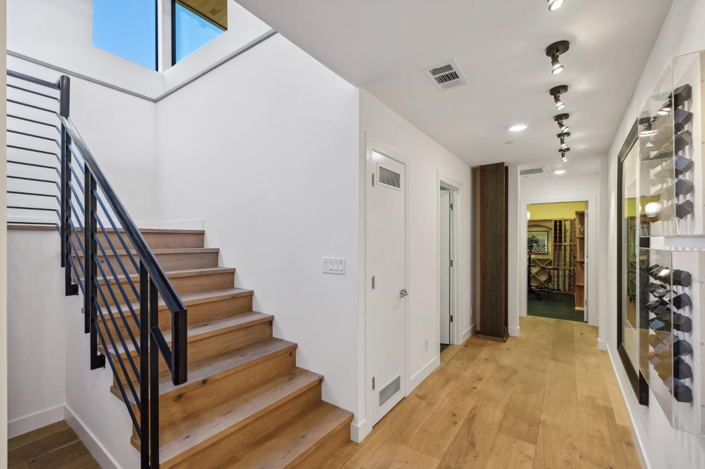 481 West Maple Way Woodside, CA 94062 - Photo 34 of 44 a view of a hallway with wooden floor and stairs