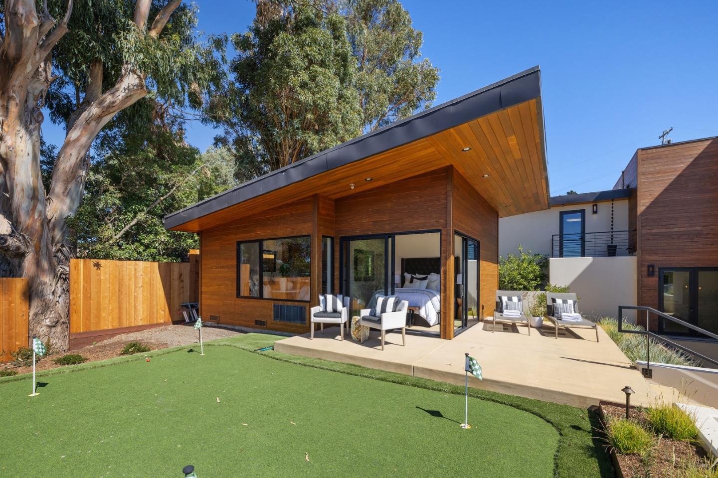 481 West Maple Way Woodside, CA 94062 - Photo 41 of 44 a view of a patio with table and chairs under an umbrella