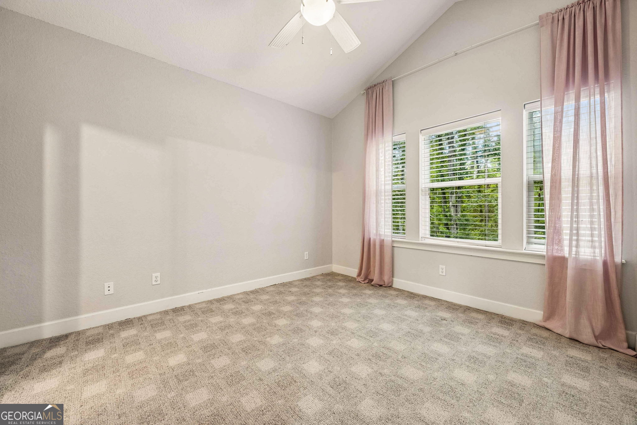 706 Hopewell Point Road White Oak, GA 31568 - Photo 45 of 84 Large secondary bedroom with vaulted ceiling, soft natural light, and generous floor space.