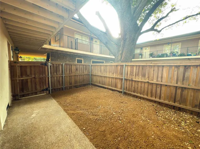 a view of a brick house with a large window