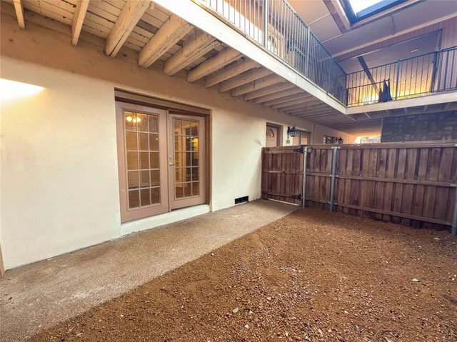 a view of an empty room with a iron stairs