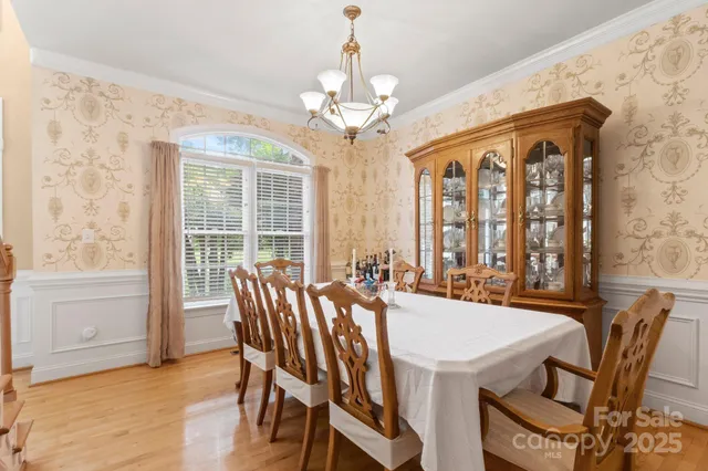 a view of a dining room with furniture and window