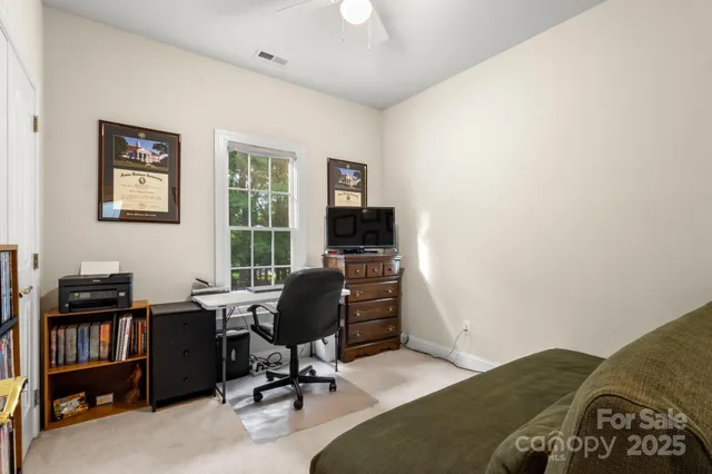 a view of a workspace with furniture