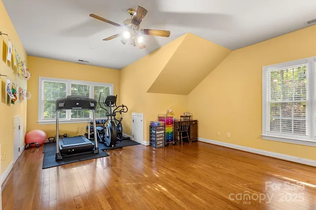 a view of a livingroom with furniture and a floor to ceiling window