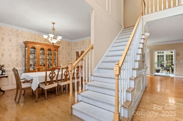 a view of a dining room with furniture entryway and wooden floor