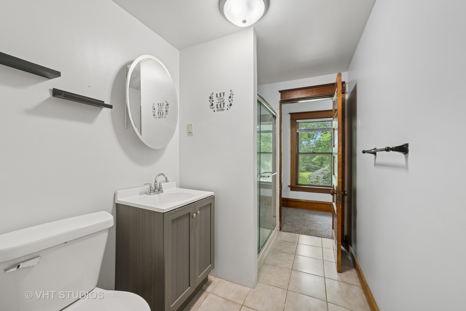 2S234 Harter Road Elburn, IL 60119 - Photo 12 of 24 a bathroom with a toilet sink and mirror