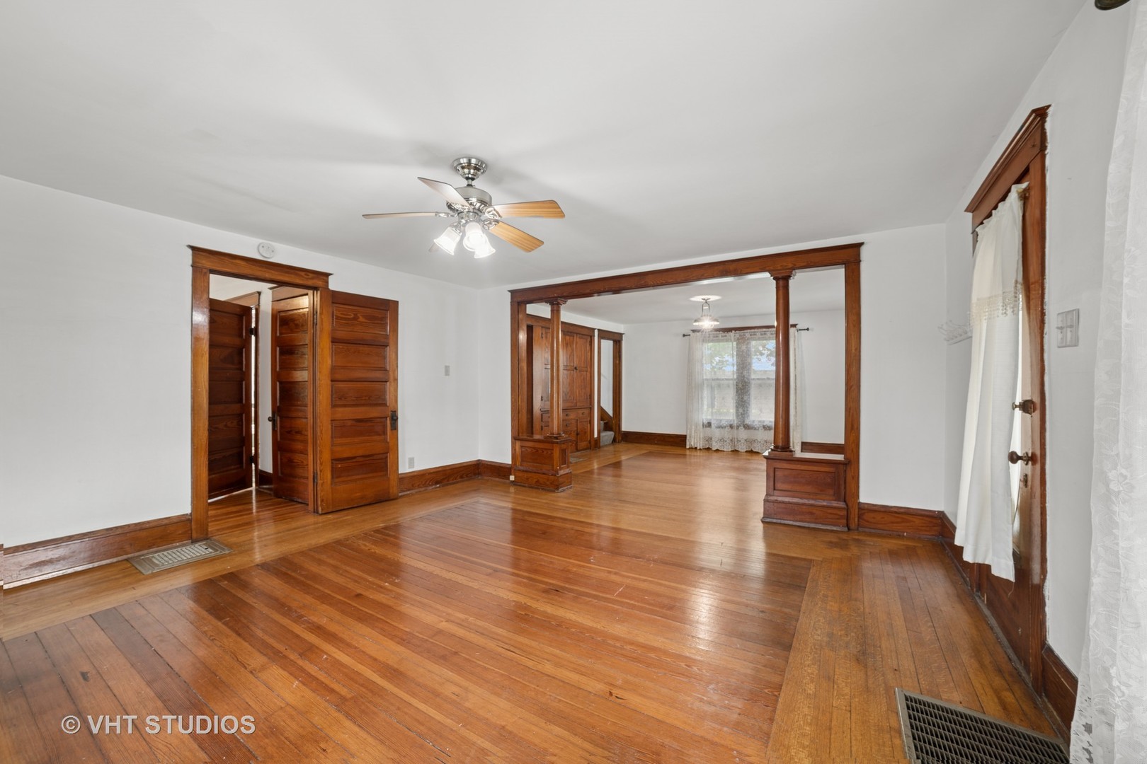 2S234 Harter Road Elburn, IL 60119 - Photo 9 of 24 a view of an empty room with wooden floor and a window