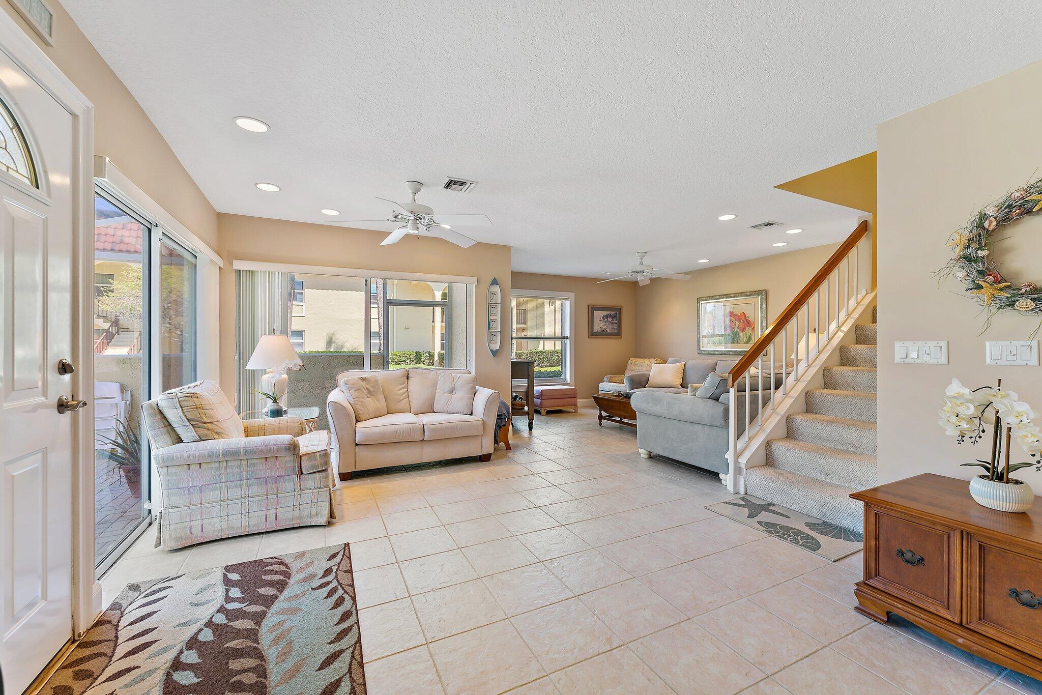 717 Highway 1, Unit 812 Jupiter, FL 33477 - Photo 10 of 41 a living room with furniture and a chandelier