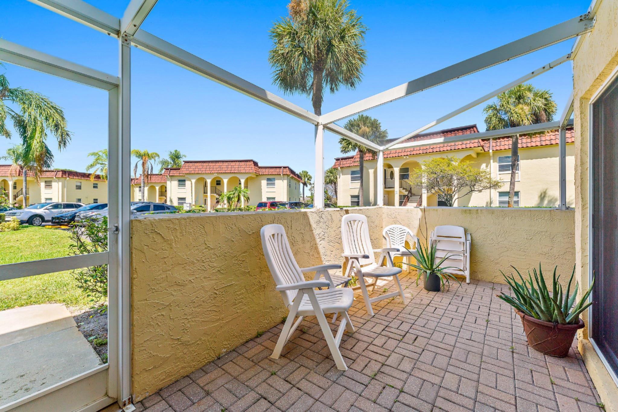 717 Highway 1, Unit 812 Jupiter, FL 33477 - Photo 11 of 41 a view of a chairs and table in a patio