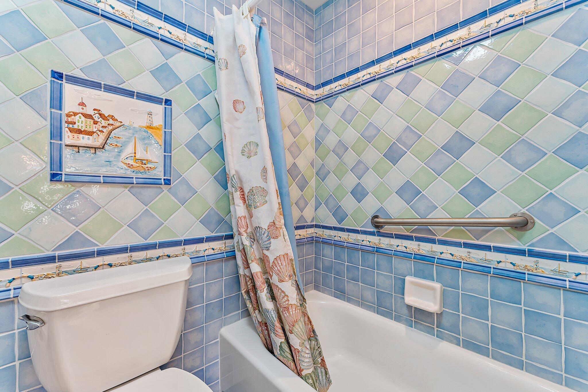 717 Highway 1, Unit 812 Jupiter, FL 33477 - Photo 21 of 41 a bathroom with a granite countertop sink and a mirror