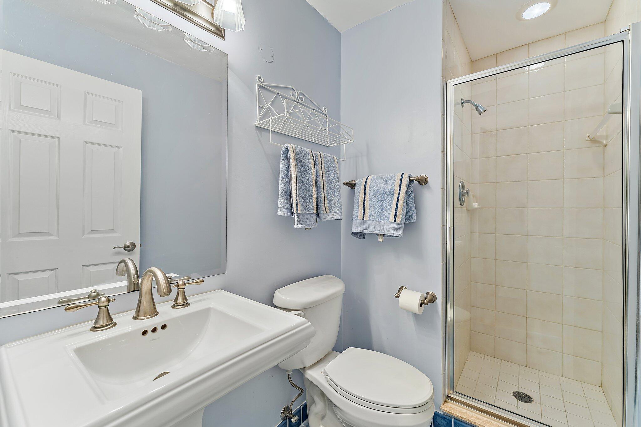 717 Highway 1, Unit 812 Jupiter, FL 33477 - Photo 24 of 41 a bathroom with a sink a toilet and shower