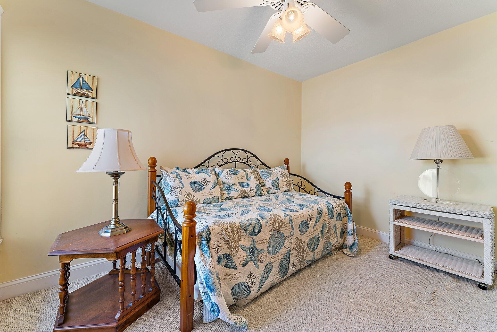 717 Highway 1, Unit 812 Jupiter, FL 33477 - Photo 25 of 41 a bedroom with bed and a table