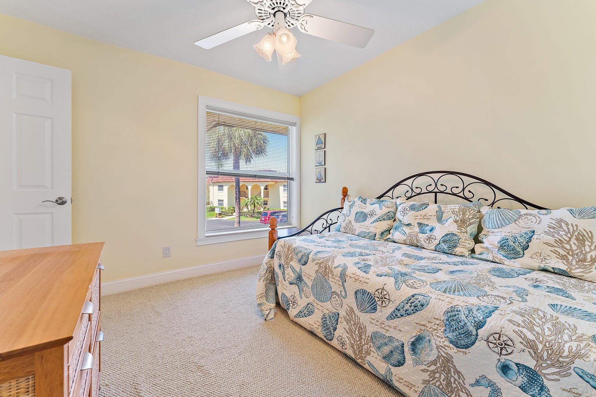 717 Highway 1, Unit 812 Jupiter, FL 33477 - Photo 26 of 41 a bedroom with a bed and a window