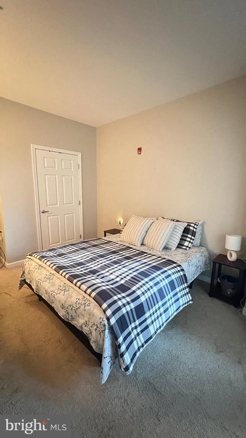 2726 Gallows Road, Unit 110 Vienna, VA 22180 - Photo 13 of 46 a bedroom with a bed and window