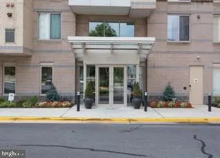 a view of a house with pool and chairs