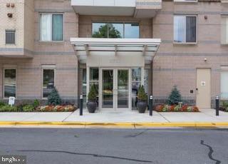 2726 Gallows Road, Unit 110 Vienna, VA 22180 - Photo 17 of 46 a view of a house with pool and chairs