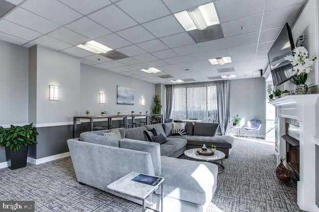 2726 Gallows Road, Unit 110 Vienna, VA 22180 - Photo 23 of 46 a living room with fireplace furniture and a fireplace