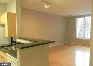 2726 Gallows Road, Unit 110 Vienna, VA 22180 - Photo 27 of 46 a bathroom with a granite countertop sink and a bathtub
