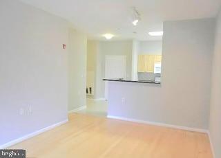 2726 Gallows Road, Unit 110 Vienna, VA 22180 - Photo 28 of 46 a view of a big room with wooden floor and windows
