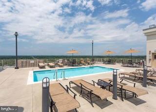 2726 Gallows Road, Unit 110 Vienna, VA 22180 - Photo 32 of 46 a view of a terrace with chairs