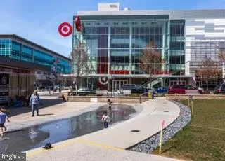 a swimming pool view with a outdoor seating