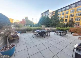 2726 Gallows Road, Unit 110 Vienna, VA 22180 - Photo 41 of 46 a view of a patio with dining table and chairs