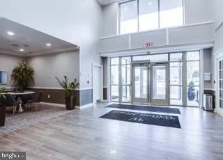 a living room with lots of furniture and kitchen view