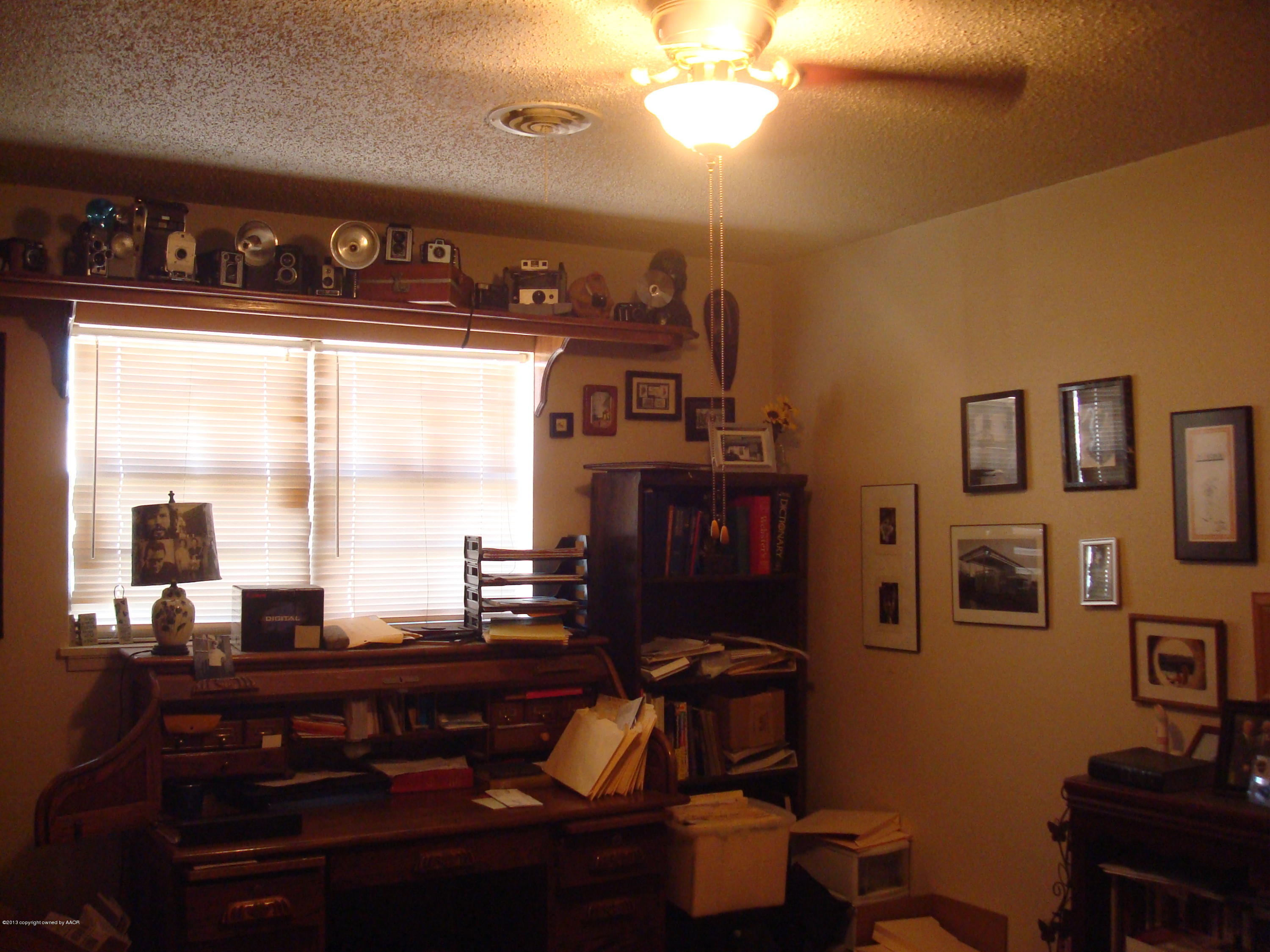 4700 South Milam Street Amarillo, TX 79110 - Photo 11 of 17 a kitchen with a table chairs and a window