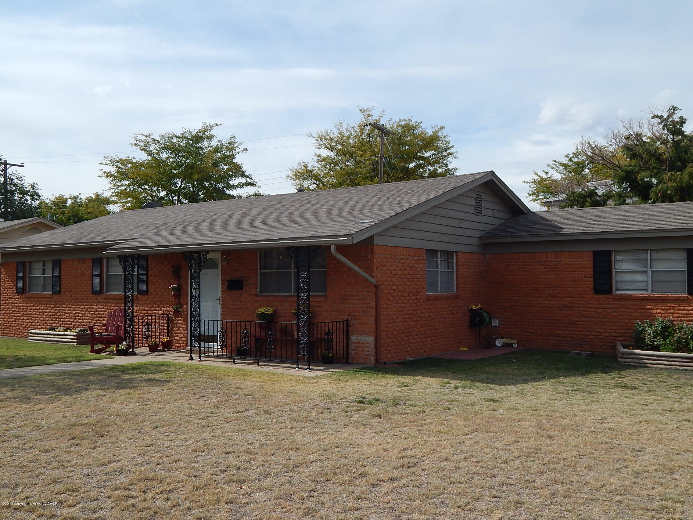 4700 South Milam Street Amarillo, TX 79110 - Photo 16 of 17 a front view of a house with a yard