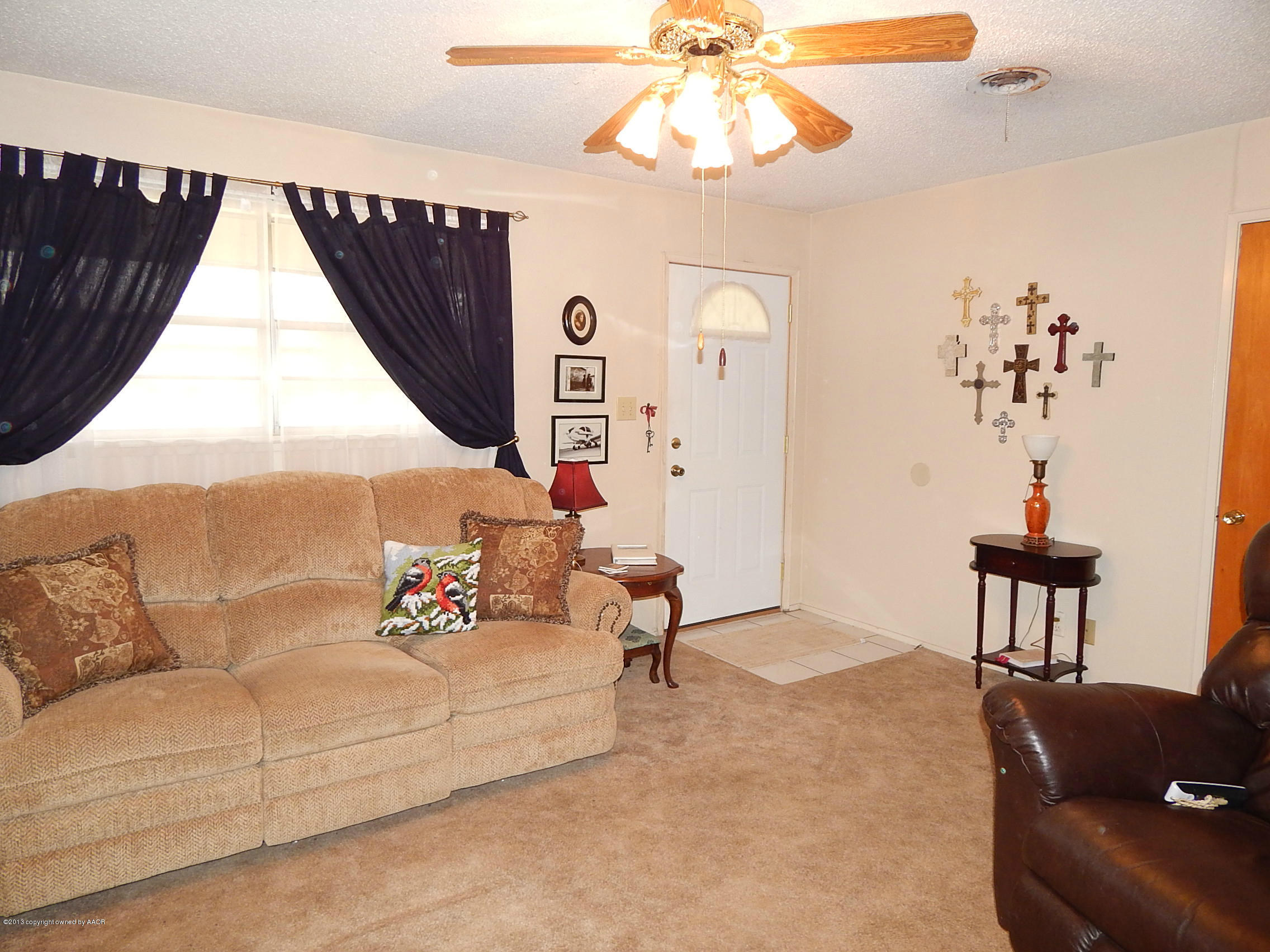 4700 South Milam Street Amarillo, TX 79110 - Photo 5 of 17 a living room with furniture and a large window