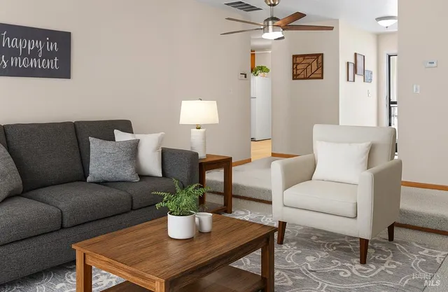 a living room with furniture and a window