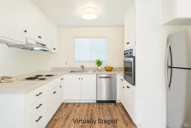 a dining room with furniture and a window