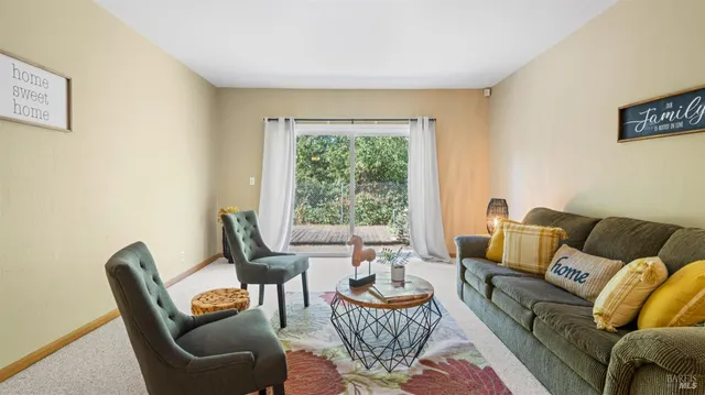 a bedroom with a bed and a potted plant