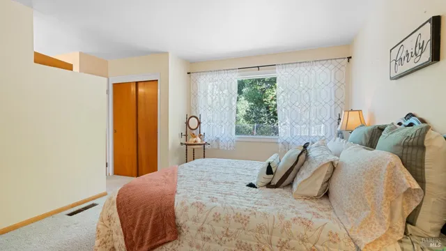 a backyard of a house with lots of green space and fountain