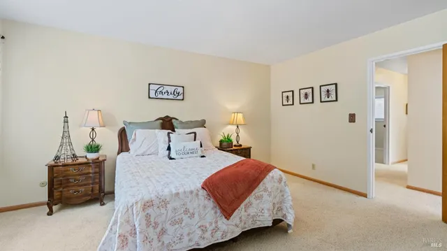 a front view of a house with a garden and plants