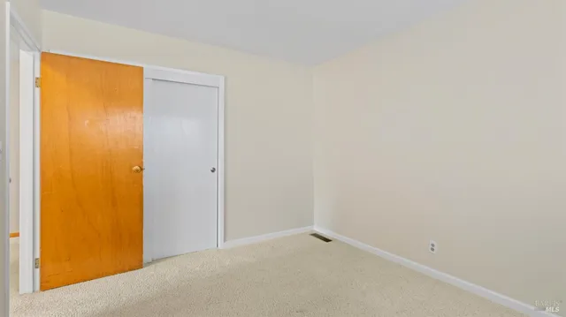 an aerial view of a house with swimming pool and garden